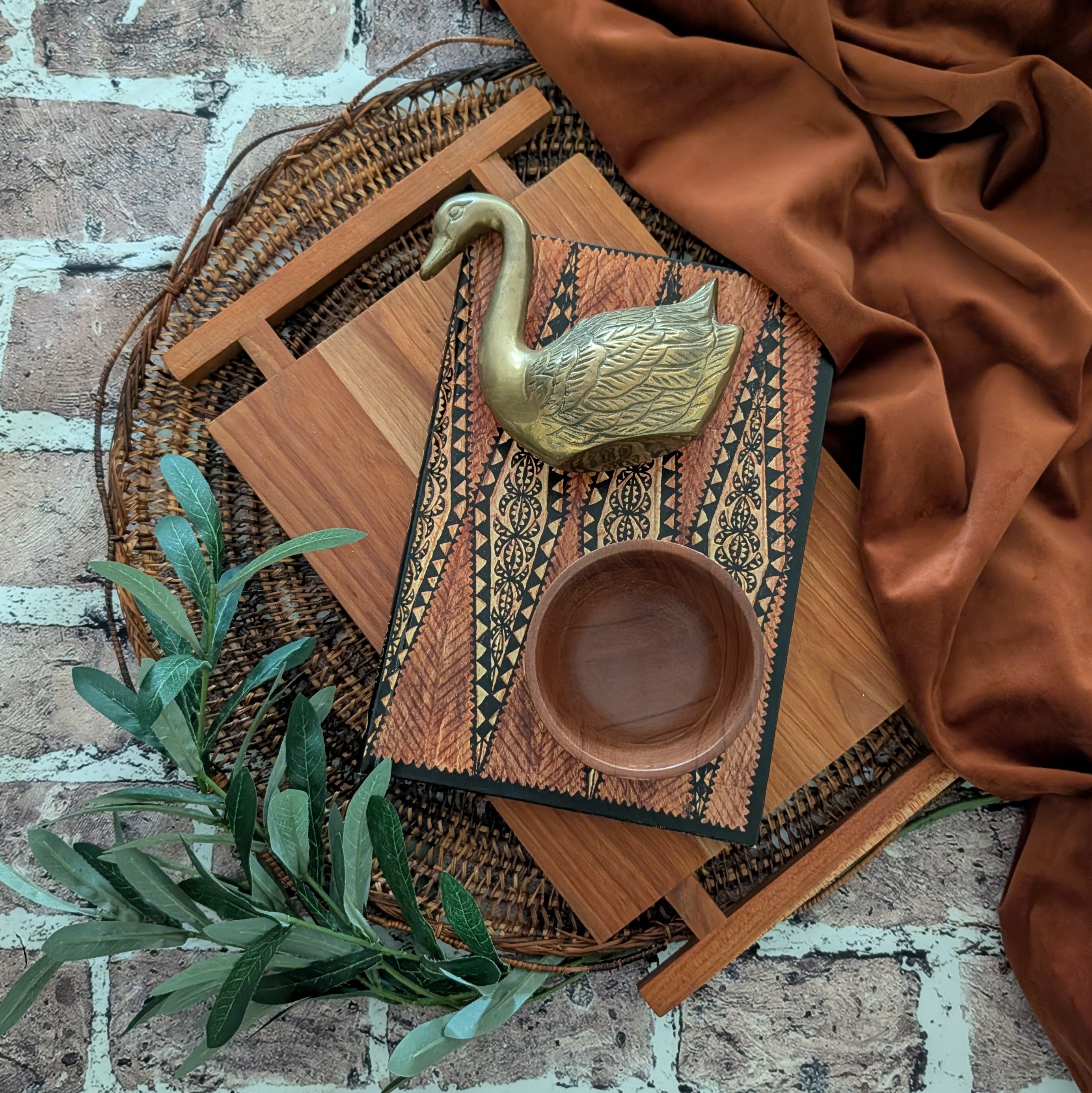Curated vintage pottery, artwork, and décor in the Moss + Amber booth